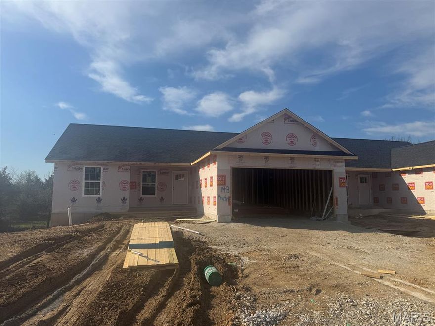 Move in your new home this June! Welcome to Grindstone Grove in Moscow Mills. Beautiful under construction ranch villa/duplex located on a nice lot that backs to some trees and has all the bells and whistles. Each home is designed for personal privacy, loaded with high quality finishes, and built by one of the best custom builders in the area. Your next home is 1216 sq ft, 3 bedroom, 2 bathroom, oversized two car garage and full walkout basement. The custom type finishes include granite countertops, stainless steel appliances, luxury vinyl plank flooring in main living area, spindled staircase railing, vaulted living room and kitchen, large center island, ceiling fans in all bedrooms and living room, can style lights, brush nickel finishes including shower door in master, and much more. Grindstone Grove is just off quiet Railroad Street with high speed Gateway Fiber internet, no monthly HOA fee, new concrete streets, street lights, and will have sidewalks throughout for homeowner safety. USDA, VA, & FHA. Agent owned Estimated completion for June move in.