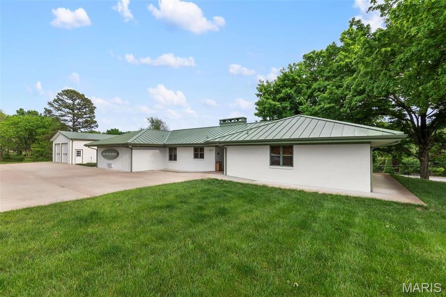 Sitting on 5.5 acres of E. Jackson Blvd frontage, the 2,433 sq ft office building with 30x40 garage/warehouse with two 10x10 doors offers plenty of space for expansion and endless possibilities. There are 3 private offices, large conference room, full kitchen/break room, two bathrooms and full en suite bathroom in main office. With executive style updates throughout, including hardwood floors, stone countertops, stainless appliances, storage area and basement for extra storage, this well-appointed office space also has a large covered patio area outdoors. Location: City, High Traffic, Hwy/Interstate Frntg