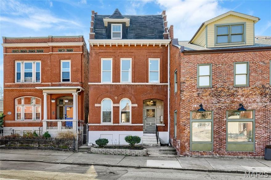 Full-brick Victorian townhome extensively renovated throughout while maintaining the charm & character of historic architecture. Recently completed updates include refinished pine hardwoods, custom-designed kitchen & baths & freshly painted interiors. Tiled front porch with arched brick entryway & original front door leads to impressive foyer, spacious living room with tiled fireplace & formal dining room. Designer kitchen features white Shaker cabinetry, quartz countertops, KitchenAid appliances, 7’ center island & butler’s pantry. Primary bedroom suite with spa-like bath with freestanding tub offers an appealing retreat. 2 Additional bedrooms with included wardrobes complete the 2nd floor living quarters. Upper level includes vaulted bedroom, bonus room & office. Situated on a private lot with deep fenced backyard with 2 parking spaces. Walkable Benton Park neighborhood just minutes from local coffee shops, restaurants & iconic Anheuser Busch Brewery with easy access to Hwys 55 & 44.