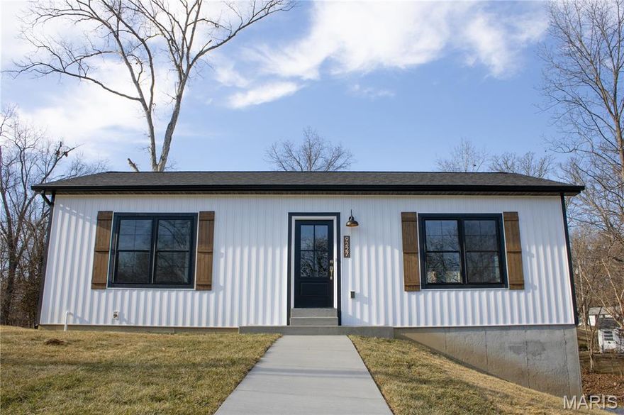 This brand-new modern farmhouse offers 2 bedrooms and 3 full bathrooms with a thoughtfully designed open floor plan. The main level features a spacious living room, kitchen, and breakfast area, along with convenient main-floor laundry equipped with a new GE washer and dryer.

The home showcases numerous high-end upgrades, blending country charm with modern elegance. The kitchen features custom soft-close cabinetry with brass hardware, a farmhouse sink with a brass faucet, and a solid live-edge butcher block countertop and island. All-new stainless steel appliances, including a refrigerator, complete the space. Brushed brass lighting highlights the kitchen, living room, and entry foyer.

Durable LVP flooring flows throughout the main and lower levels, including the open stairway. All three full bathrooms include matte black fixtures, coordinating vanities, and modern lighting. Craftsman-style 3-panel Heritage Series doors are featured throughout the home.

Bedrooms are equipped with smart ceiling fans and remote controls. Additional upgrades include black-and-white double-hung windows, a striking Thermo-Tru black fiberglass front door with an antique brass handle, and a French door off the breakfast room with a white interior, black exterior, and antique brass hardware.

The finished lower level offers a spacious recreation room and a full bathroom. The home also includes a 2-car oversized tuck-under garage with two 8’ x 9’ insulated black garage doors featuring glass windows and Chamberlain smart technology openers. The exterior is finished with white board-and-batten siding accented by black LP trim, soffits, gutters, and downspouts.

Move-in ready and loaded with upgrades—this stunning new construction is a must-see.