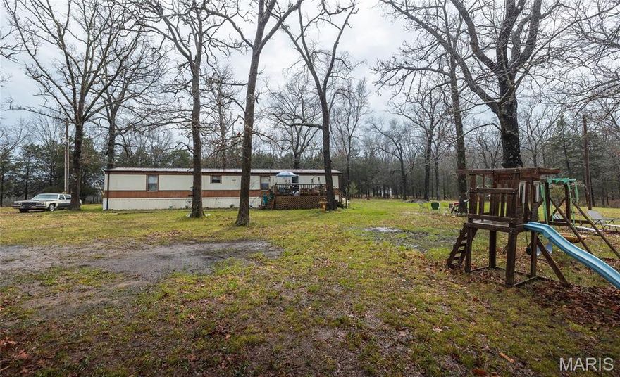 Charming 2-bedroom, 2-bath home situated on nearly 7 acres of peaceful, serene surroundings—perfect for those seeking privacy and a little extra space to enjoy the outdoors. This well-maintained and exceptionally clean home offers everything you need with a comfortable and functional layout, featuring durable laminate flooring throughout.

Step outside and take in the beautiful setting from the back deck, ideal for relaxing, entertaining, or enjoying your morning coffee while overlooking your acreage. The property also includes multiple sheds, providing plenty of room for storage, hobbies, or outdoor equipment.

With a great balance of indoor comfort and outdoor space, this property offers the best of country living while still being convenient to nearby amenities. Whether you're looking for a full-time residence or a peaceful retreat, this one is ready to welcome you home!