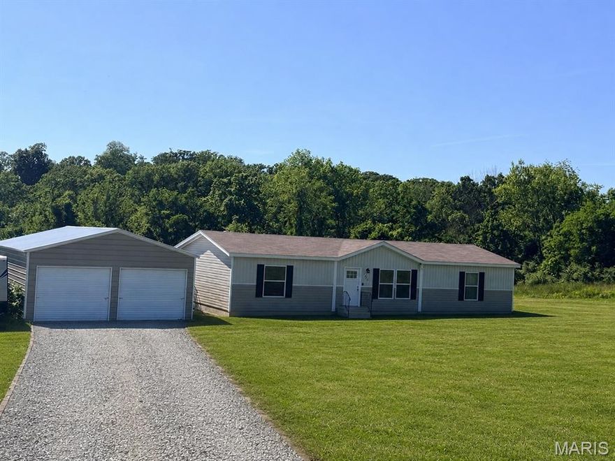 Practically new and move-in ready. This beautiful 3 bed, 2 bath home sitting on 3 acres offers the perfect blend of modern comfort and peaceful country living. Built in 2021 and barely lived in, the home still feels brand new with its inviting open layout, spacious feel, and well-maintained condition. Nestled on a quiet street, you can enjoy the privacy and serenity of rural living.

Outside, the detached 2-car garage provide endless possibilities for vehicles, equipment, hobbies, entertaining, or weekend projects. Whether you’re looking for room to spread out, space to enjoy the outdoors, or simply a quiet place to call home, this property checks all the boxes. Rare opportunity to own acreage with a newer home that is truly move-in ready.