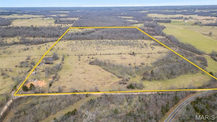 This 255± acre tract represents a well-balanced property with the kind of diversity and usability serious land buyers look for. Less than 0.2 miles of gravel rd from highway access. Dual access from two separate roads allows for excellent ingress, egress, and operational flexibility. The property is comprised of mixed pasture and mature timber, creating a strong setup for mixed agricultural use. Gently rolling terrain supports livestock, hay production, or equestrian use, while the timber provides both habitat and long-term value. Established walnut trees. Water resources- with three ponds, two spring-fed creeks, and two existing wells, along with utilities already on site. The combo of open ground, timber, and water creates excellent wildlife habitat, making this a highly attractive hunting property. Privacy can be tailored to the buyer, all while maintaining easy access via quality country roads. Conveniently located near Interstate 44 and Lake of the Ozarks, this is a versatile, high-quality tract that’s becoming increasingly difficult to find. Schedule a private showing to fully appreciate what this property has to offer. Call for a private showing.