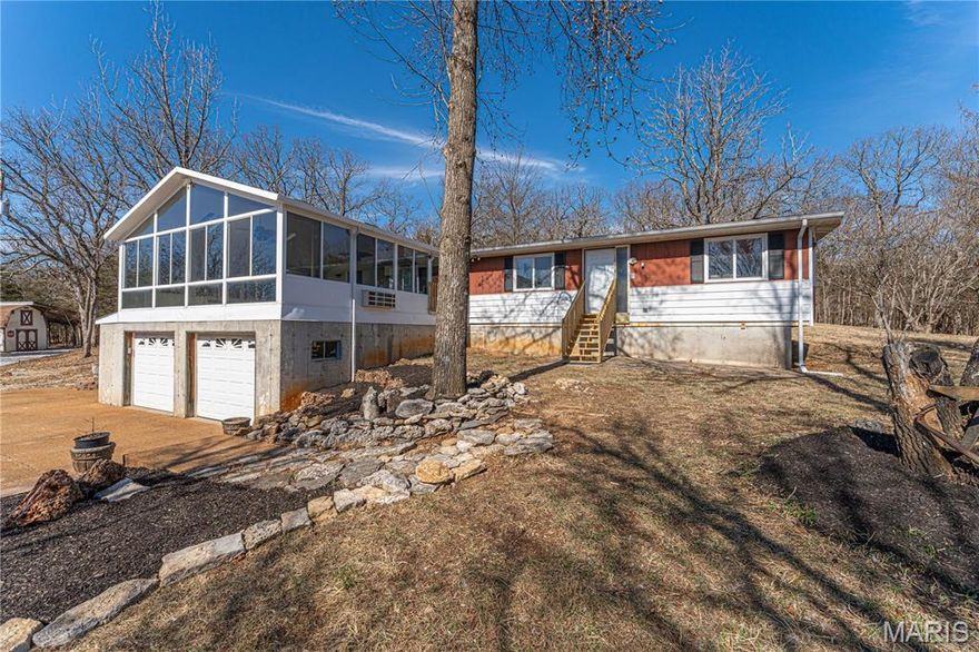 NOW ACTIVE!  – 7 Acres of Opportunity! Nestled on a beautiful 7-acre tract, this 3-bedroom, 2-bath home offers the perfect blend of comfort, updates, and room to roam. It was installed as a modular home and has a framed addition added. Whether you're looking for peaceful country living or space to expand, this property delivers both privacy and functionality. Inside, you’ll find updated kitchen appliances that make meal prep a breeze, along with major improvements already completed — including a brand-new roof and a new HVAC system for long-term peace of mind and energy efficiency. One of the standout features is the stunning, oversized sunroom addition, offering abundant natural light and the perfect space for relaxing, entertaining, or enjoying panoramic views of your acreage year-round. Outside, new gravel has been added to the entire driveway, providing improved access and a clean, refreshed look as you enter the property. This property is coming soon and will be available to cash or conventional buyers starting Friday, February 27th. Seller has a home inspection and a septic / well inspection in hand. Don’t miss your opportunity to own acreage with valuable upgrades already in place — Need to see to appreciate!