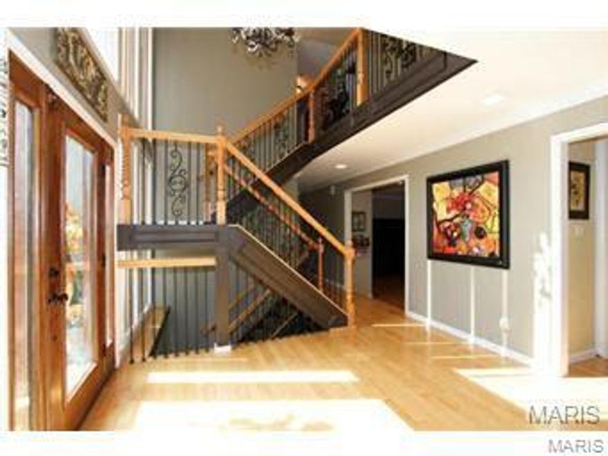 Enchanting curb appeal instantly draws you in to this custom remodeled home. A two story foyer, with open staircase, beautiful lighting & impressive millwork, reveals endless possibilities. Wood floors flow effortlessly from room to room. WOW the gourmet in your family with large eat-in kitchen complete with 6 burner gas stove, stainless appliances, custom cabinets, big center isle & granite counters. Step out to the deck or relax in the massive sunroom off the sunken great room overlooking a lush backyard & updated pool. First floor stylish powder room with slate floors, huge laundry & office. Master suite is an indulgent treat with custom walk-in multi-head shower, jet tub & custom tile. Three more large beds, plus updated hall bath with jet tub, dual sinks & custom floor top off the 2nd level. Walk out lower level with full bath.