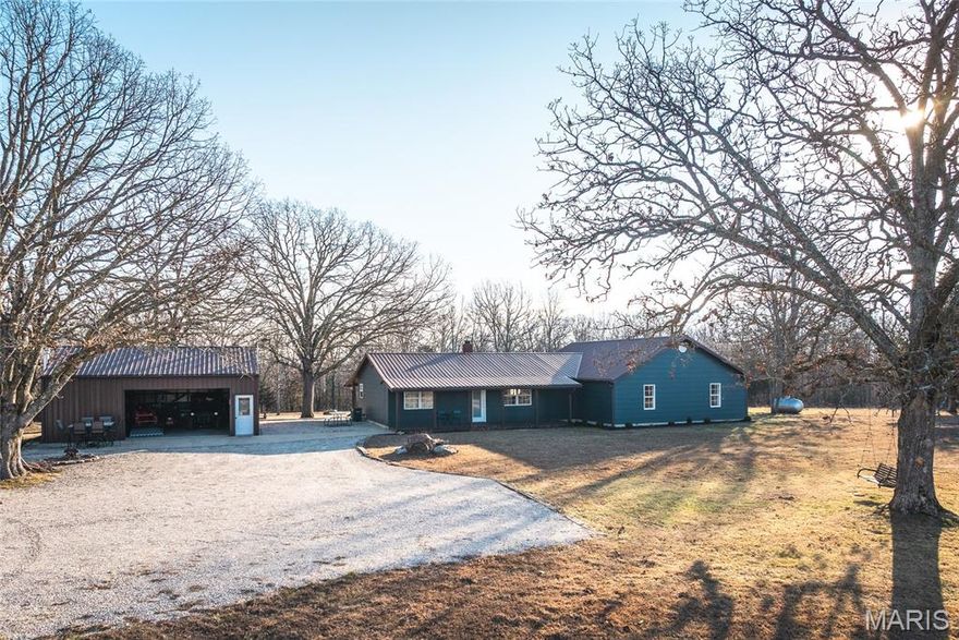 This 101.2+/- acre multi-purpose property offers a rare combination of a recently remodeled home, well-appointed recreational amenities, and versatile land in the heart of the Ozarks, just minutes from the spring-fed Current River. The property is well suited for a family retreat, hunting property, short term rental, horses and trail riding, or as a full-time residence with room to roam.
The land includes a mix of open fields, mature timber, and a wet-weather creek, creating a well-balanced property with quality habitat for deer, turkey, and small game. An enclosed deer blind overlooking a field is already in place, and the layout allows for continued wildlife management and recreation throughout the year.
The original home was completely remodeled in 2014, and a new 1,400 square foot addition was added in 2022.  The home now offers 5-bedrooms and 2 ½ bath rooms with approximately 2,400 square feet of living space. The interior showcases quality craftsmanship throughout while offering comfortable, modern living.  Dual HVAC systems provide efficient, zoned heating and cooling.
An outdoor patio and entertainment area offers a great space to gather with family and friends. A 960 square foot semi-finished, heated detached garage with a concrete floor provides excellent workspace and storage. Additional shed and stable space add functionality, and the property includes a 400-yard shooting range with an established platform and bench.
If you’re looking for a true Ozarks recreational retreat with a comfortable, updated home, excellent location, and hard-to-find improvements already in place, this property deserves a closer look.