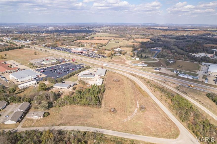 REMARKABLE OPPORTUNITY to own 4 acres of commercial land in Farmington 
with road frontage on Woodlawn AND Red Rooster!
This property has VERY HIGH VISIBILITY of Hwy 67!!
Property is cleared, ready to build on has access to ALL PUBLIC UTILITIES! Location: City, Corner Location, Hwy/Interstate Frntg