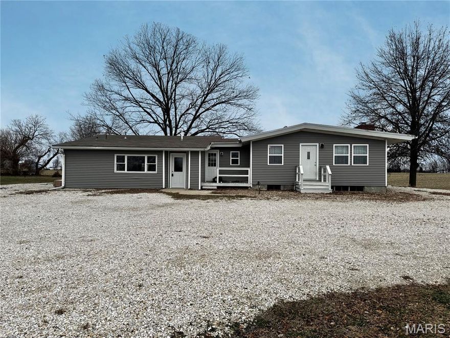 Open House, Sunday, January 18 from 1-3pm. Welcome to 405 E Main Street, Lewistown, Missouri 63452, a meticulously remodeled home that combines modern comfort with spacious living. This 3-bedroom, 2.5-bath residence, up dated in 2023, features a luxurious primary suite with a corner jetted tub and a walk-in tiled shower equipped with dual showerheads. The main floor laundry adds convenience, while the newer kitchen and dining area are perfect for culinary pursuits and gatherings. Relax in the inviting living room complete with a fireplace. The basement offers two framed bedrooms, a bath stubbed in, and additional living space, all with a convenient walk-up exit, allowing you to finish it to your needs. Set on approximately 1.8 acres, this property includes a circle drive, two portable sheds, and ample room to build a shop. Don’t miss your chance to own this exceptional, remodeled home!