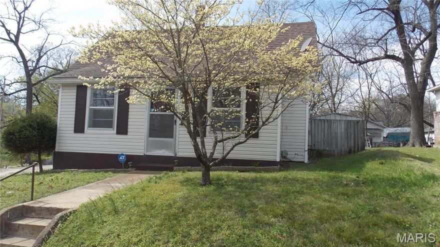 Very cute 2-bedroom, 1-bath vinyl-sided home with a fenced rear yard and a relaxing screened porch for privacy.