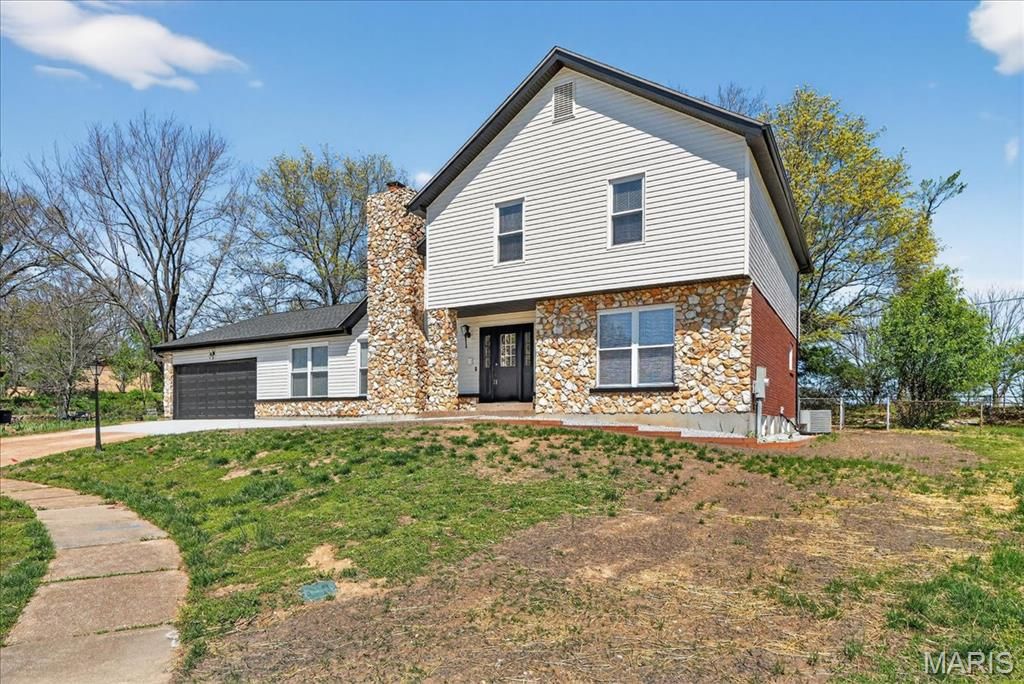 Photo of 5039 Amber Place Drive, St Louis, MO 63128 (MLS # 26019870)