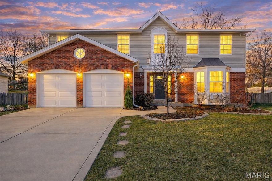 Welcome to 4910 Lowndes Drive, tucked inside a quiet, family-friendly neighborhood served by Mehlville Schools. One of the largest homes in the subdivision, this property offers the space, comfort, and thoughtful updates today’s buyers are searching for. From the moment you arrive, the inviting curb appeal sets the tone, and inside, a dramatic two-story foyer and warm hardwood floors create a welcoming first impression. The heart of the home is the beautifully updated kitchen with center island and bay windows that fill the space with natural light, flowing seamlessly into the spacious family room where soaring vaulted ceilings, a cozy fireplace, and wet bar make it the perfect place to gather. Step outside to the back patio overlooking a large, private, fully fenced yard ideal for summer evenings, playtime, or entertaining friends. The main floor also offers the convenience of laundry and a powder room, while the partially finished lower level with an additional half bath provides flexible space for recreation, hobbies, or guests. Upstairs, three comfortable guest bedrooms share an updated full bath, and the expansive primary suite serves as a true retreat with double sinks, a soaking tub, separate shower, and a generous walk-in closet. Major updates completed in 2025 including a new roof, siding, gutters, downspouts, and two new garage doors—add peace of mind and long-term value. This is a home designed for living well, growing comfortably, and making lasting memories.