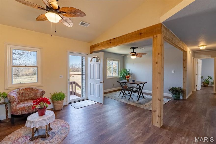 Take in sunset views from your upper deck over looking the valley in this peaceful,l country setting w/ room for everyone! Situated on 2.85 acres right on the Miller/Maries County line, the spacious 5 bed, 3.5 bath home offers privacy where your closest neighbors are cows & baby calves. Inside find 2 ensuite bedrooms, making this property ideal for large or multi-generational families. Upper level ensuite has walk in shower & garden tub. The layout offers 2 living spaces & French doors off the garage landing allowing home to be separated for flexible living arrangements. Heated oversized garage has extra space for a workshop, ATVs, golf carts & add'l storage. Speaking of storage, this property has LOADS of closet space. Recent updates include new warrantied siding on three sides of the home, newer stainless steel appliances, new LVP flooring throughout main level & new water heater. An exterior wood stove keeps utility costs down & wood pile stored under carport conveys @ closing. If you’ve been searching for space, storage, and peaceful country surroundings close to beautiful Lake of the Ozarks, Ft. Leonardwood or Jefferson City, this property in Vienna School District delivers.