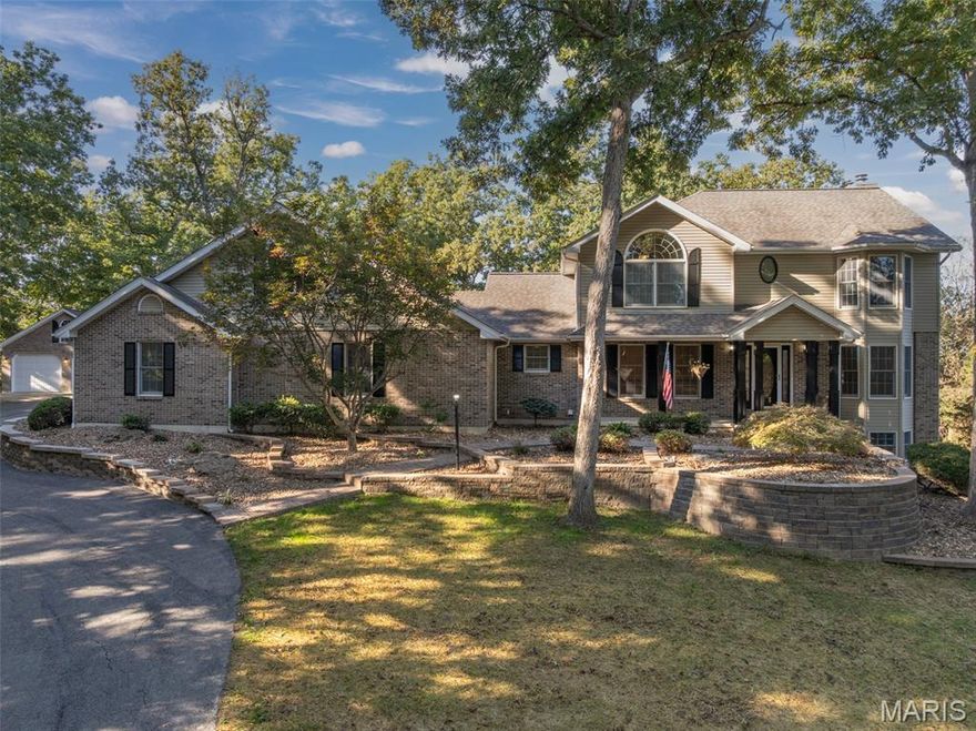 Stunning Custom Home on 8.26+/- Unrestricted Acres – No HOA! Nestled in a serene, park-like wooded setting, this beautifully crafted 5-bedroom, 3.5-bath home boasting a total 3,400 Sq. Ft. is located in the highly sought-after Silex School District and just 14 minutes from Troy’s shopping and dining. Situated on a scenic, wooded hilltop off a paved road, the property offers the perfect blend of privacy and accessibility. Step inside to find custom features throughout, including hardwood floors, vaulted ceilings, special millwork, and two cozy fireplaces. The spacious eat-in kitchen is a chef’s dream with a center island, breakfast bar, oak cabinetry, pantry, and separate formal dining room—ideal for entertaining. Additional highlights include a welcoming entry foyer, main-floor laundry and central vacuum system. Make your way to the upper level, where sophistication and comfort await—offering an elegant primary suite featuring dual vanities, a spa-like soaking tub, separate walk-in shower, and expansive custom walk-in closets; three additional well-appointed bedrooms; and a beautifully designed full hall bath. The partially finished lower level walk-out offers even more living space with a large rec room, built-in bar, additional bedroom and full bath, plus ample storage. Car lovers will appreciate the oversized attached 3-car garage and a large detached 2-car garage—perfect for hobbies, extra vehicles, or a workshop. Enjoy beautifully landscaped grounds, mature trees, and all the peace of rural living—with no restrictions and no HOA! Your new sanctuary awaits!