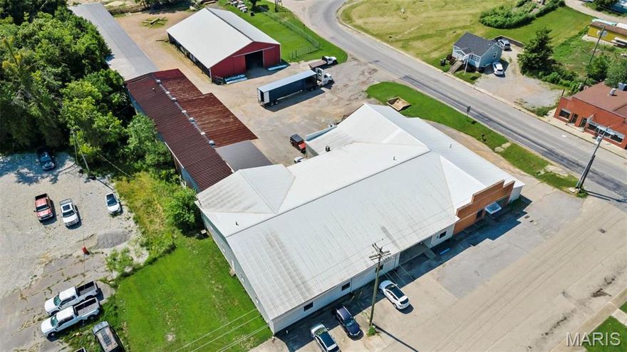 Located on 2.02 acres on 308 Crown St in Marble Hill MO, 63764.  Currently being used as Marble Hill Lumbar & Supply LLC with over 12,00 square feet of area to work with!  17 concrete parking spots, fenced back lot plus inventory.  Building offers:  2 office areas, multiple overhead doors, bathroom, break room and so much more!  Sale to include Real Estate and Equipment.  Inventor and office Equipment is negotiable. Location: City, Corner Location, High Traffic, Retail Center