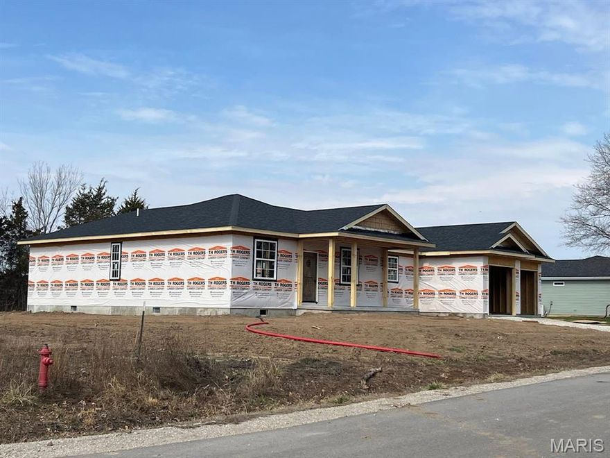 Construction in now underway for the next beautiful home on Patton Lane! This builder doesn't miss a single detail & adds tons of custom features in all their homes. Located on a .48 ac lot in a quiet neighborhood just on the edge of town on a PAVED ROAD, this 2,400 sq. ft. home will offer THE most desirable floor plan around with 4 bedrooms, 2.5 baths, & a 2-car garage. The spacious kitchen will have gorgeous quartz countertops, a huge center island, custom cabinets, a walk-in pantry, & SS appliances. There will be gorgeous hardwood floors & tile flooring along with 9’ ceilings throughout. The living room will have a vaulted ceiling w/ custom wood beam. A large primary suite will have double sinks, a walk-in custom tiled shower, a freestanding soaker tub, & a walk-in closet. The floor plan features the much-desired split bedroom layout AND a 4th bedroom/office. Estimated completion date of May 2026. Act fast and you can even make a few choices as it's being finished!  (Note: photos are from the most recently completed home - finishes will be of similar quality & style.)