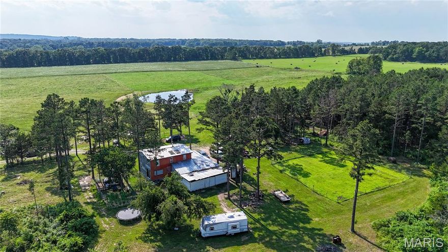 Discover nearly 20 acres of beautiful countryside, perfect for those seeking a peaceful retreat or looking to start a homestead. This unique property features a 1,500 sq ft Amish-built cabin that offers rustic charm and solid craftsmanship. The cabin is currently off-grid with no utilities, providing the perfect blank canvas for your sustainable living vision.

The land is a stunning mix of fenced-in pasture—ideal for livestock—and wooded acreage with established trails, great for hiking, exploring, or hunting. Whether you're dreaming of a hobby farm or a secluded getaway, this property offers a rare combination of open space and natural beauty.

Additional features include a small greenhouse for growing your own produce and plenty of room to expand with gardens, barns, or additional structures. Don’t miss this opportunity to own a slice of countryside ideal for quiet living, outdoor adventure, or building your dream homestead from the ground up.
