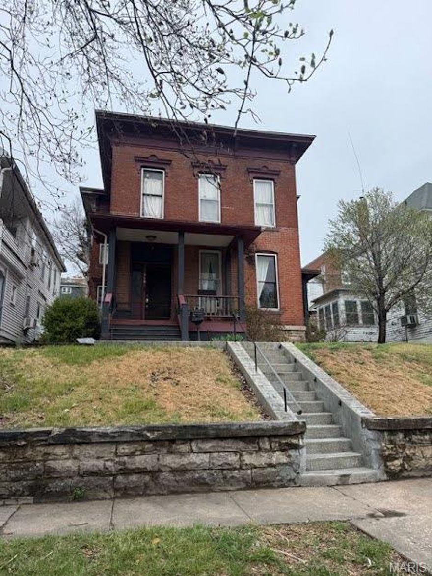 Two-story, brick historic home with four bedrooms and two bathrooms. The home has many original features like hard wood floors, fireplaces, and woodwork. The main level has living room with pocket doors, dining room, bedroom, bathroom with walk-in shower, and kitchen. The kitchen has wood cabinets and appliances convey. Off the kitchen is access to the patio and backyard. The second floor offers three bedrooms, one full bathroom, and laundry room. The main bedroom has a spacious built-in closet area. Home has terraced backyard. Located near downtown Hannibal with over 2,400 square feet of living space.
