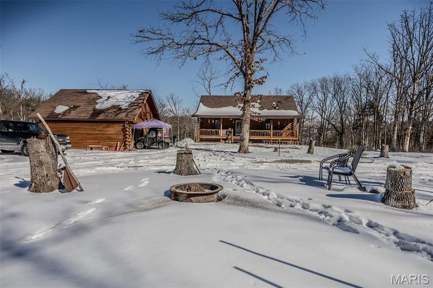 Welcome home! This delightful 3-bedroom, 2-bathroom log cabin sits on over 8 acres of enchanting land, complete with awesome trails just waiting to be explored.

Inside, you’ll find rustic charm at every turn, from the exposed wood beams to the grand wood-burning fireplace that’s perfect for cozy evenings. The open floor plan is ideal for both relaxing and entertaining, and the loft area adds a rustic touch, perfect for a cozy reading nook or a playful hangout space.

And when you step outside, you’ll be greeted by that huge covered back porch, perfect for sipping morning coffee or unwinding at sunset. Plus, with trails winding through the property, adventure is right at your doorstep!
