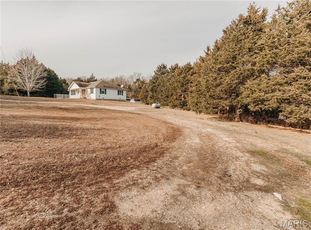 Photo of 12280 Chicago Road, Dixon, MO 65459 (MLS # 25079021)