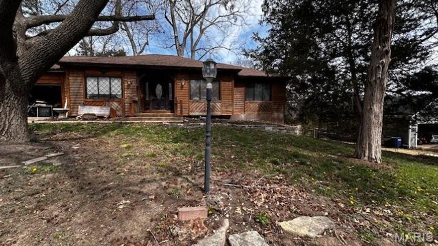 an inviting home awaits, poised for immediate enjoyment. This residence is perfectly ready for occupancy, offering a seamless transition into a comfortable living experience. The three bedrooms within this residence provide peaceful havens, each designed to offer comfort and personal space for quiet moments and restorative sleep. Two well-appointed bathrooms ensure convenience and ease for daily routines, offering essential amenities in a refreshing environment. A dedicated laundry room simplifies household chores, providing a practical and organized space for daily necessities. Built in 1977, this single family residence embodies a lasting appeal, offering a solid foundation for a comfortable living experience. Outside, a convenient shed provides additional storage solutions, perfect for keeping belongings neatly organized. An exceptional opportunity to embrace a lifestyle of comfort and convenience.