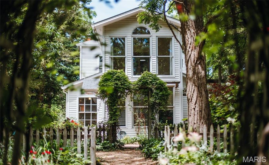 Step into one of Rolla’s most captivating historic homes. Nestled along the iconic Salem Avenue — known for its storybook collection of historic properties — this remarkable 3-bedroom, 2-bath home offers the kind of charm and character that simply cannot be recreated. From the moment you arrive, the property feels timeless, welcoming, and unforgettable. Inside, rich wood floors stretch throughout much of the home, while oversized windows fill each space with natural light. The living room centers around a stunning original wood-burning fireplace, creating a warm and inviting atmosphere that feels pulled from another era. French doors, intricate trim work, vintage details, and unique architectural touches give every room its own personality. In addition to the three bedrooms, the home also features two bonus rooms — ideal for an office, library, studio, guest space, or additional living area. Just off the kitchen, the sunroom offers one of the home’s most distinctive features: a spiral staircase leading to the upper level, adding even more charm and character to this truly one-of-a-kind property. Outside is where this home becomes something truly magical. Situated on an incredible .82-acre lot in the heart of town, the backyard feels more like a private botanical retreat than a city property. Winding garden trails lead through an established landscape filled with mature trees and native plants, creating a peaceful oasis with beauty around every corner. Multiple fenced areas provide endless possibilities for pets, entertaining, gardening, or quiet outdoor escapes. A lovely back patio invites slow mornings, evening gatherings, and everything in between. The property also includes a large circle drive, a detached 2-car garage with an attached workshop and attic space, plus an exceptionally tall carport capable of accommodating an RV. Homes like this rarely come available. Rich with history, overflowing with charm, and tucked into one of Rolla’s most beloved streets, 618 Salem Avenue is more than just a home — it’s a once-in-a-lifetime opportunity to own a piece of local history.