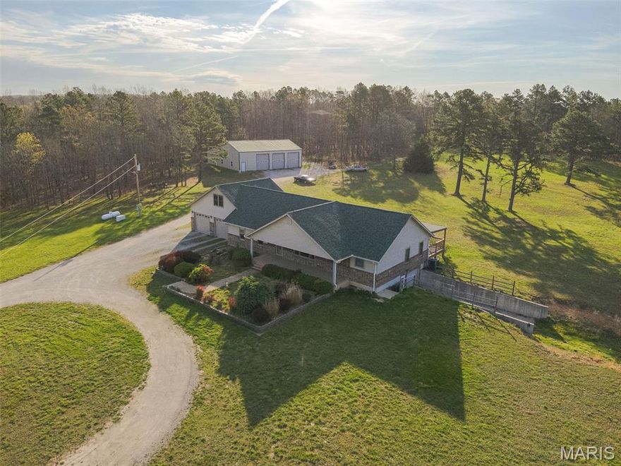 This Custom Home is slightly under 5,000 sq. ft with garages under the roof! Approx. 3700 finished. Sits on 83.6 acres with perimeter fencing. Large 40x60 shop with all the extras, including a lift. Lean too on the back for additional storage. 2x6 construction. New Anderson windows throughout! New HVAC, Roof, New Master Bath with heated Jacuzzi tub and walk-in tile shower. All are handicapped and wheelchair-accessible. New Paint and some flooring. Open Concept. Custom Oak Cabinets with soft pull-out drawers. Pantry, Breakfast Bar with Chairs. Formal dining. Separate Den. Large mud room with sink. Walk-outs to covered decks. The home is wheelchair-accessible, with a ramp, extra-wide hallways, and accessible bathrooms. There are 2 Separate living quarters with separate basement entrances. Great for 2 families. Private setting. Comes with a whole-home generator. It's a generack.  Home sits back from the road. This is a hunter's paradise. Close to Jacks Fork River, Alley Springs and Mark Twain Forests