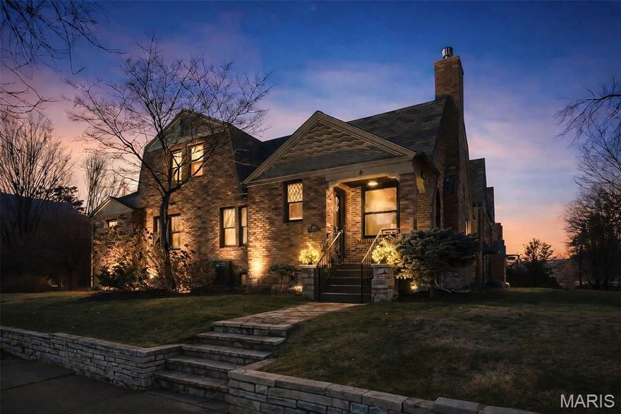 Welcome to a truly special Clayton residence where storybook charm meets modern luxury. This Dutch Colonial, with its English Cottage influences, sits proudly in one of the most beloved pockets of Clayton—an area celebrated for its architectural character, unmatched walkability, and nationally recognized schools. And this home has been thoughtfully revitalized to honor its heritage while elevating everyday living.

Step inside to find a warm, inviting interior that blends rich original details with fresh, high-end updates. In recent years, the owners invested in substantial improvements: extensive electrical upgrades including new wiring, outlets, switches, a whole-house surge protector, and rewired Wi-Fi for exceptional connectivity; new insulation; new drywall where needed; crisp, modern paint; and a curated selection of designer lighting and ceiling fans. The landscaping has also been reimagined to create more usable green space and enhance curb appeal.

The floor plan is wonderfully flexible, offering options for those who work from home or prefer main-floor living. Two bedrooms, a full bath, and a laundry room with utility sink are conveniently located on the main level. The kitchen—bright, spacious, and centered around a massive island—features granite counters, fresh paint, stylish hardware, a new cooktop, dishwasher, and a refrigerator that stays. A charming breakfast room, window seat, butler’s pantry, and a bar with wine storage and beverage fridge make this the natural heart of the home. The elegant dining room is open to both the kitchen and gathering spaces, perfect for hosting.

Upstairs, a custom, lighted, original handrail leads you to three more spacious bedrooms with beautiful hardwoods throughout. The updated hall bath keeps vintage character alive with modern convenience. The serene primary suite impresses with organized closets and a stunning renovated bath featuring double sinks, linen cabinetry, a luxurious air-jetted tub, heated marble floors, and a heated towel rack.

The finished walkout lower level adds a cozy family room, half bath, and abundant storage. An oversized 2-car garage provides even more storage and workshop space. Outdoors, enjoy a lovely patio, lush lawn maintained by irrigation, and a truly exceptional detail—the slate tile roof, inspected in 2022 and estimated to have 30–40 years of life remaining. The two-car garage provides extra space for organized storage, an electric vehicle charger, and a quiet, wall-mount garage door opener.

All of this, just a stroll from Shaw Park, Meramec Elementary, and the shops, cafes, and dining of downtown Clayton. A rare opportunity to own a beautifully restored piece of Clayton architecture that lives as comfortably as it looks.