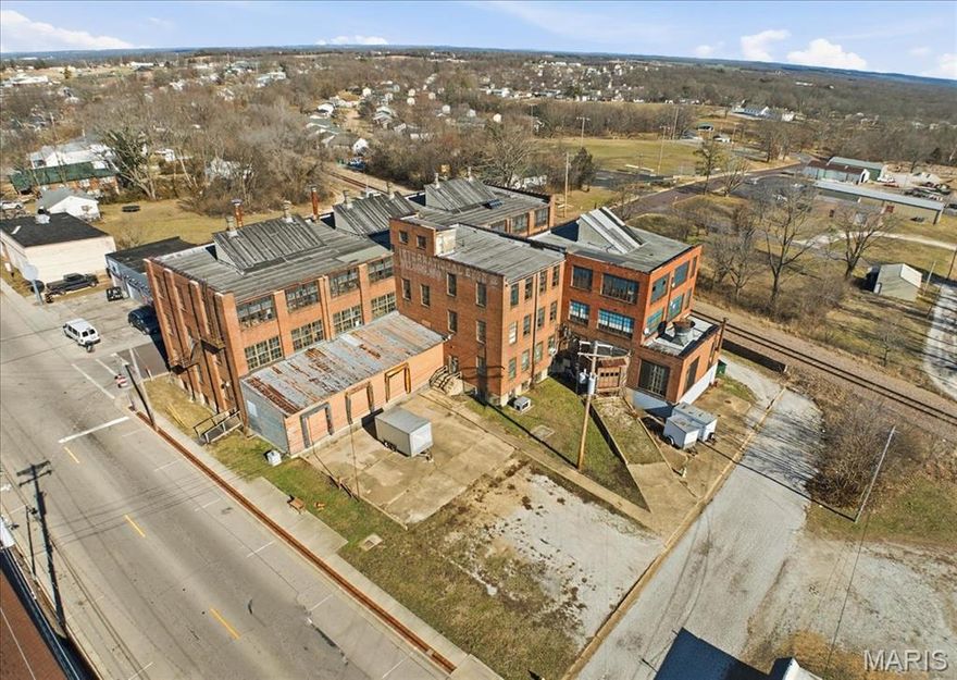 A rare opportunity to reimagine a 39,000± SF historic commercial landmark—formerly the Old Shoe Factory—offering exceptional upside and architectural character you simply can’t replicate today. Rich in history and scale, this iconic building features truck dock access, expansive interior spaces, and solid bones that create an outstanding foundation for transformation. While the property is in need of modernization, it presents a compelling canvas for adaptive reuse, redevelopment, or industrial conversion. Ideal for investors or end-users seeking a high-impact project, the flexibility of the layout lends itself to a wide range of potential uses, including industrial, warehouse, creative, or mixed-use concepts. Step into the next chapter of this historic asset and unlock its full potential.