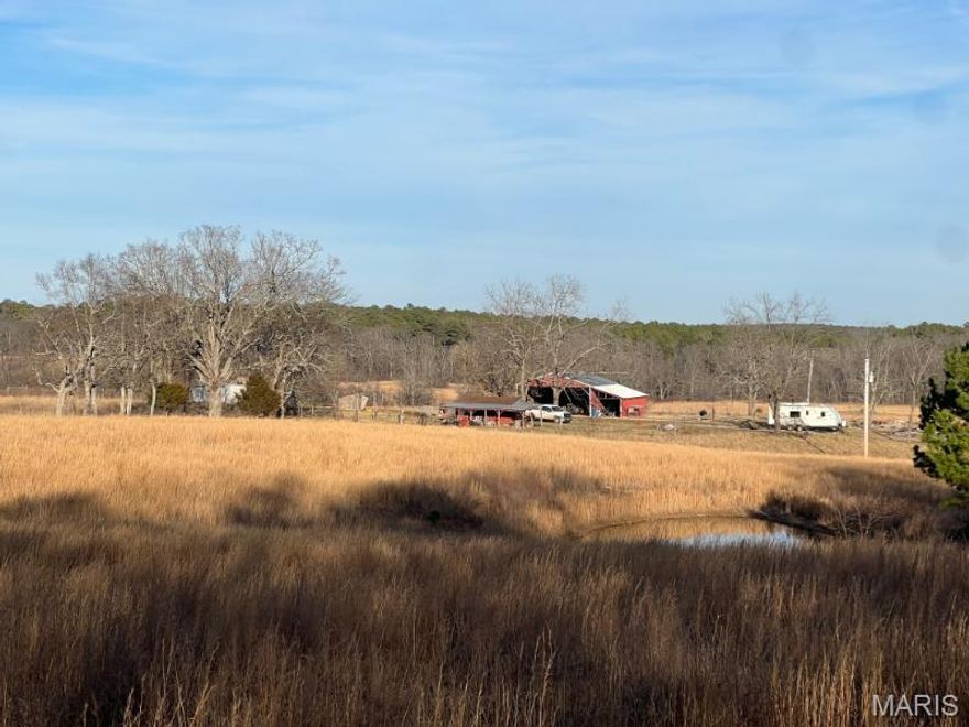 Bring your tractor and animals to this stunning property that is ready for country living!  Featuring three ponds, a 30x40 barn with electric, additional outbuildings, plus electric, well, and septic already in place.  Enjoy 20 acres of nearly all pasture, fenced and cross-fenced, perfect for livestock, your RV, or building your dream home.