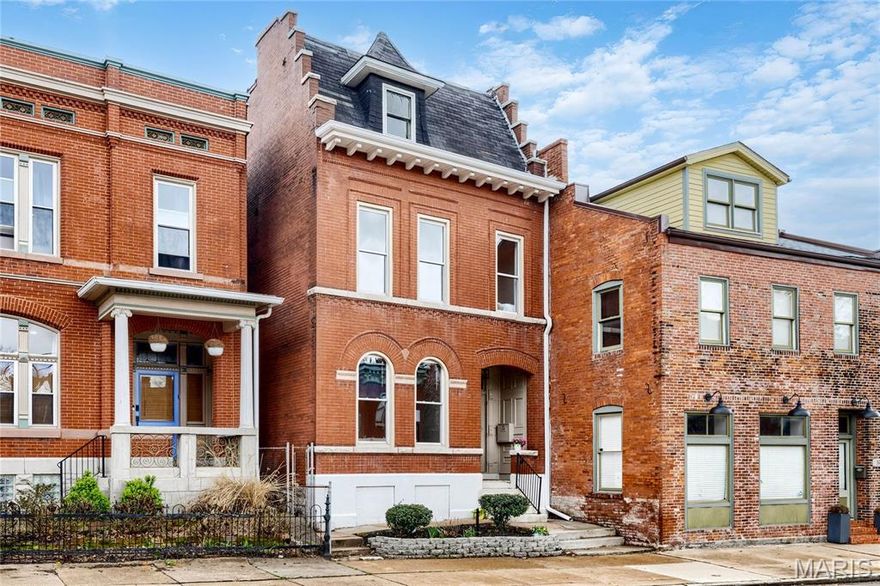 Full-brick Victorian townhome extensively renovated throughout while maintaining the charm & character of historic architecture. Recently completed updates include refinished pine hardwoods, custom-designed kitchen & baths & freshly painted interiors. Tiled front porch with arched brick entryway & original front door leads to impressive foyer, spacious living room with tiled fireplace & formal dining room. Designer kitchen features white Shaker cabinetry, quartz countertops, KitchenAid appliances, 7’ center island & butler’s pantry. Primary bedroom suite with spa-like bath with freestanding tub offers an appealing retreat. 2 Additional bedrooms with included wardrobes complete the 2nd floor living quarters. Upper level includes vaulted bedroom, bonus room & office. Situated on a private lot with deep fenced backyard with 2 parking spaces. Walkable Benton Park neighborhood just minutes from local coffee shops, restaurants & iconic Anheuser Busch Brewery with easy access to Hwys 55 & 44.