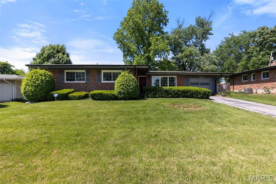 Located in the award-winning Lindbergh Schools district, this beautifully updated brick ranch offers the perfect blend of charm, comfort, and well-designed space. With over 2,100 square feet of total living area, this 3-bedroom, 2-bath home welcomes you with vaulted ceilings, abundant natural light and many recent updates. An inviting open-concept floor plan that provides seamless flow between the kitchen, living, and dining rooms, which are complemented by oversized picture windows and a charming fireplace hearth. The stunning updated kitchen features quartz countertops, newer stainless steel appliances, ample cabinetry, and generous prep space ideal for everyday living and entertaining alike. Recently installed and refinished hardwood floors run throughout the main floor and the bedrooms. The spacious primary suite features two closets and an updated bath. Two additional bedrooms and a full bath round out the main floor. The lower level adds incredible versatility with approx. 780 sq. ft. of finished living space that can be divided to meet your specific needs with areas that are perfect for movies and lounging, a home office and a personal gym. All this and still abundant storage and a newly built laundry room - awaiting your personal touch. Step outside to enjoy the large fenced backyard, complete with mature trees, perennial landscaping, and a welcoming patio. All made more relaxing thanks to the brick privacy wall along the back. An extra-long one-car garage, new roof (2024) and new gutters complete this move-in-ready Crestwood gem — a home that truly has it all.