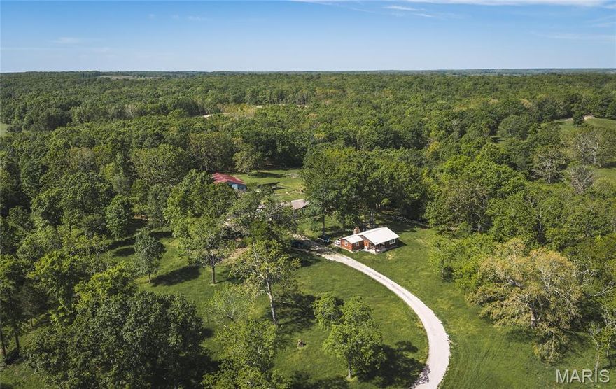Opportunities like this don’t come around often—10 acres of usable land paired with not one, but two beautifully updated homes and an oversized barn, creating the perfect blend of flexibility, privacy, and potential. Whether you’re dreaming of multi-generational living, rental income, or a peaceful homestead with room to grow, this property delivers a lifestyle that’s hard to find.

The main residence, a brand-new 2025 manufactured home, offers modern comfort with a fresh, move-in-ready feel from the moment you step inside. Just a short distance away, the charming 2-bedroom, 1-bath log cabin has been completely gutted and thoughtfully remodeled, blending rustic character with updated finishes—ideal for guests, extended family, or even a short-term rental opportunity.

Step outside and take in the space around you. An established pecan orchard adds both beauty and seasonal bounty, while the oversized barn opens the door to hobbies, storage, livestock, or workshop needs. The acreage invites you to spread out, and with an RV hookup already in place, hosting guests or traveling with ease is effortless. With utilities connected to each structure, three separate septic systems, and the added benefit of solar panels, this property is set up for both convenience and efficiency.

If you’ve been searching for a property that offers versatility, income potential, and room to truly live your lifestyle, this is it. Schedule your private showing today and experience everything this one-of-a-kind property has to offer!