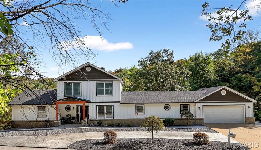 Beautiful 1.5-story waterfront home in the gated lake & golf community of Raintree Plantation! Step inside to hardwood floors and a soaring great room with a floor-to-ceiling stone fireplace flanked by windows that fill the space with natural light. The remodeled kitchen features stainless appliances, quartz counter tops, granite center island, custom cabinets, and vinyl plank flooring. A spacious loft overlooks the main level. The primary suite offers a walk-in closet, soaking tub, and separate shower. Finished walkout lower level includes 2 bedrooms (both with walk-in closets), full bath, storage, and family room. Enjoy stunning lake views from the atrium/bay door leading to expansive new composite deck, perfect for entertaining. Exterior highlights include a circle drive, portico entry, large front and back patios, stone retaining walls, hot tub and private lake front gazebo with spectacular lake front views. Bonus: 3rd tuck-under garage space, main floor laundry, private golf cart path from home to lake and corner lot with loads of extra parking. Resort-style living at its best! MOTIVATED SELLER!! Seller says Bring Us An Offer..