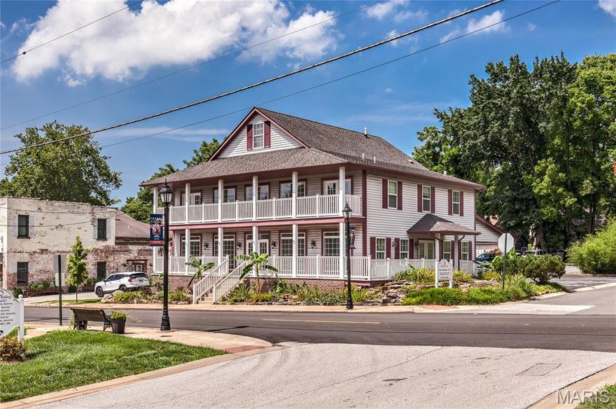 Elegant UPSCALE low-rise office/retail building just 5 blocks from Florissant City Hall on HIGH-TRAFFIC corner lot at Rue Saint Francois. 5600 sq ft on 0.2975 acre lot, walking distance to quaint restaurants, shops & salons in desirable Old Town Florissant. Incredible CURB APPEAL with stacked wrap-around covered porches, grid/transom windows, lush professional landscaping with fountain feature and post light. Premium CORNER SIGNAGE, low-maintenance vinyl siding, brick detail, enclosed soffit/fascia, rear quad carport. Grand lobby entrance with high-end finishes. Main floor features: event room with double door entry, ceramic tile flooring; 3 offices with wood flooring; kitchen area with dishwasher and refrigerator. Second floor features: 5 offices with carpet, unique interior balconies with iron railing. Basement is finished: dual door entry on both sides, plus 2 full windows; restrooms with showers; laundry area. Five HVAC systems include 2 zones main, 1 upper and 2 lower. Parking for approx 19 vehicles (4 covered spaces) with easy access from both streets. White vinyl privacy fence alongside rear parking lot. Furnishings are negotiable. Leased month-to-month for $90k/yr through October. Close to Highways 67/270/170.