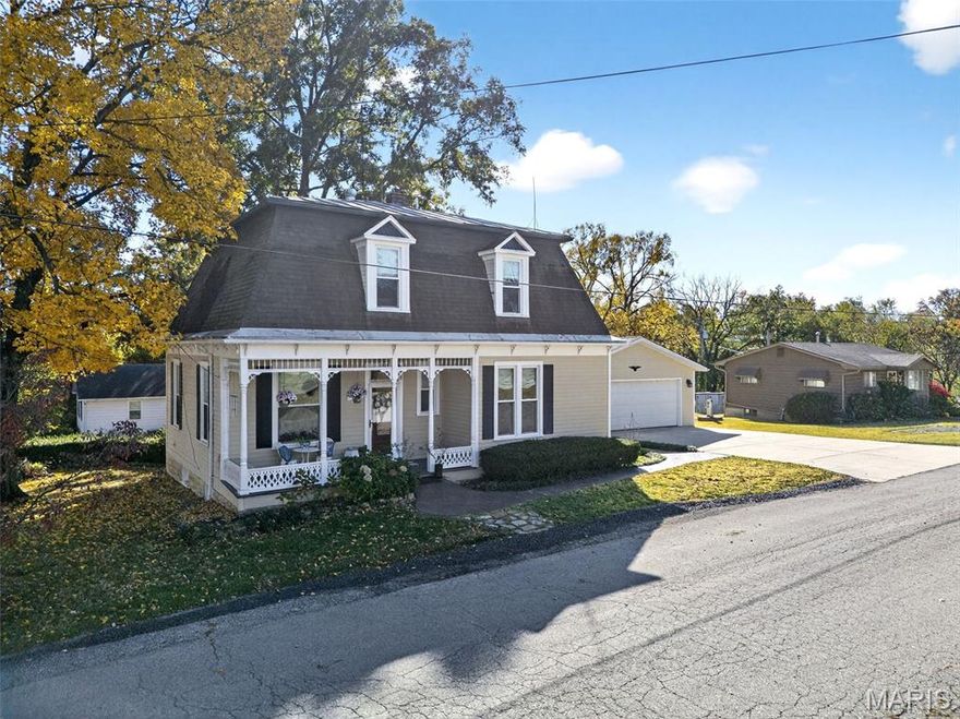This is not your typical Augusta home. 5548 Chestnut delivers over three finished levels of flexible living, a main-level primary bedroom, and a layout designed for real functionality.

The main floor offers a true primary bedroom and full bath, multiple living areas, main-level laundry, and seamless flow from kitchen to dining to sunroom. Hardwood floors, built-ins, and detailed millwork add character without sacrificing usability.

Upstairs, two oversized bedrooms stretch nearly 29 feet deep and connect through a Jack & Jill bath, each with walk-in closets. The layout provides flexibility for guests, children, work-from-home space, or multi-generational living.

The finished lower level expands your options even further with a large family room, office area, recreation or dining space, and abundant storage.

The renovated primary bath features marble tile and custom finishes that elevate the home beyond expectation.

Situated on a prominent corner lot with detached two-car garage, this home is steps from Augusta’s town park and just two blocks from wineries, shops, and the Katy Trail. Walk to dinner. Walk to live music. Walk home.

Two full bathrooms. Main-level bedroom. Oversized upstairs layout. Finished lower level. Garage. Prime location.

This one stands out.