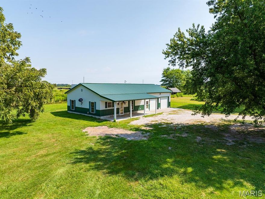 Very UNIQUE modern-day Home in the Country with instantaneous RADIANT FLOOR HEAT throughout including a separate thermostat for the huge 28' x 28' heated garage/workshop.  This HIGH END but low operating cost feature along with the traditional HVAC and an oversized AC with easy to maintain radiant heated concrete flooring provides low energy costs.  This incredible OPEN LIVING Concept with 2' x 6' walls that are 10' tall finished with painted metal & stained wood throughtout all make for a solid, well-built low maintenance home.  How about a Jacuzzi tub with an added shower head and a cedar lined closet in your Master Bedroom?  Wait....run the hot water for the Jacuzzi tub, the shower, the dish washer and the washing machine at the same time NO PROBLEM....INSTANT HOT WATER!  Looking for a home without stairs, Custom built barn doors and Western Decor throughout this is it!  A Jenn Air Stove and a Double Oven in your massive Kitchen with a HUGH Island just inside YOUR 10' x 36' Covered Patio that stays warm even in the Winter with heat radiating from the interior heated floors are great features for YOUR enjoyment!   In case you're not aware; this Custom Built MORTON BUILDING will never need painting or a new metal roof or siding!  Are you visualizing a traditional 4' x 8' Island without the beams in your kitchen?  Different paint colors on the metal walls or cabinets or maybe Luxury Vinyl Plank Flooring that is designed to be installed over radiant floor heat?  Call Listing Agent for details!