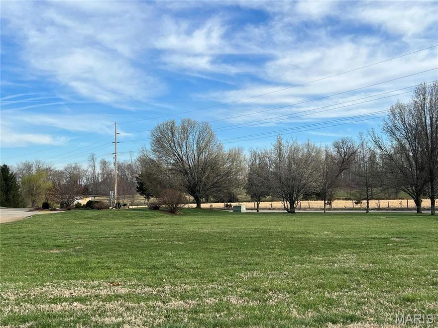 Exclusive subdivision adjacent to golf course and lake. Greenbriar Estates.  Lot on cul-du-sac.  Feels like you are miles from town, but actually in the city limits.