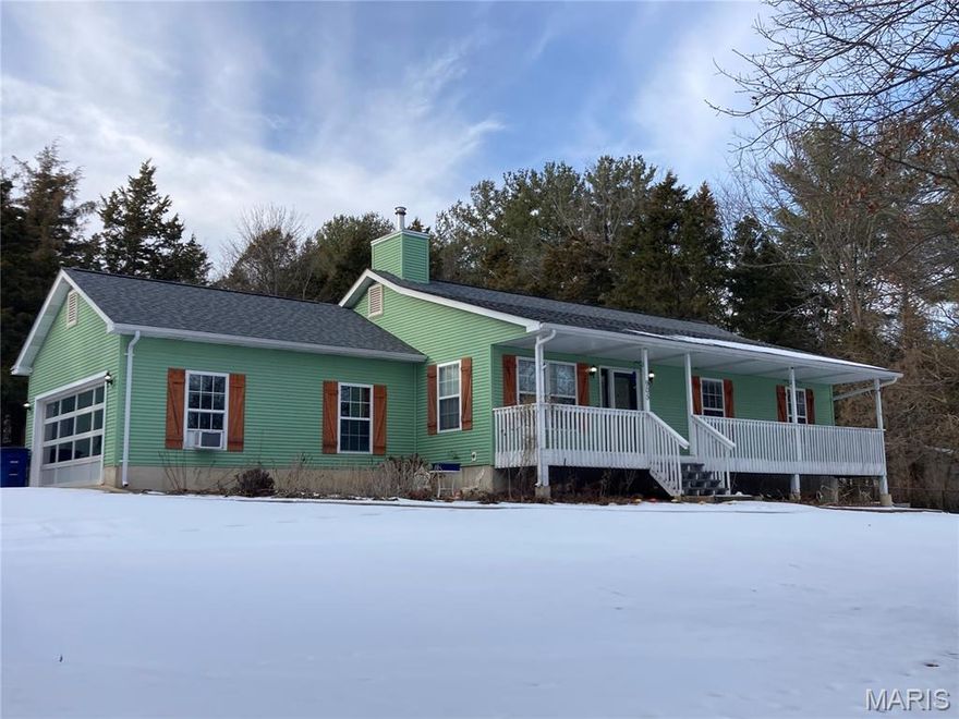 When location and functionality count...this is it!!! Nice Ranch home with a delightful front porch and a complementary rear deck. Home offers 3  main level bedrooms,  3 full baths, a walk-out lower level, and an awesome outbuilding all on +/- 2 acres. Attached garage has been converted to a family/entertainment area but could be converted back. Additional bedrooms in lower level. Easy access to the highway and pretty setting.