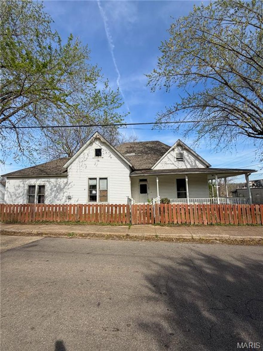 Located in the heart of Doniphan, this 2194 +/- sqft home offers space, flexibility, and a convenient in town location. Featuring 5 bedrooms and 3 bathrooms, the property has previously been used as a duplex and could be easily converted back for investment or multi-generational living. The layout includes two separate living areas, each with its own kitchen and laundry space, with one side offering 2 bedrooms and 1 bathroom, and the other featuring 3 bedrooms, 2 bathrooms, and a bright sunroom. Outside, you'll find a fenced-in yard, perfect for pets, kids, or added privacy, making this a versatile property with plenty of potential.