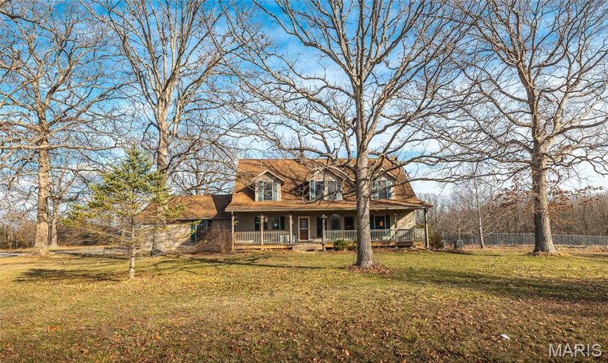 If you’ve been dreaming of wide-open space, peaceful views, and a home that feels warm the moment you walk in — this is it. Situated on 44+ acres of fenced and cross-fenced pasture, this 5-bedroom, 3.5-bath farmhouse offers the perfect blend of rustic charm and everyday functionality. Inside, you’ll immediately notice the tongue-and-groove pine ceilings and walls that create a cozy, lodge-style feel throughout the home. The main level is designed for convenience, featuring a spacious primary suite with a private bath. Upstairs offers four additional bedrooms plus a bonus room — ideal for guests, hobbies, or a growing household. The finished walk-out basement provides even more living space, perfect for a second living area, recreation room, or entertaining. Step outside and everything is ready for your livestock and country lifestyle. The acreage includes established pasture, an existing hay field, a pond, and fencing already in place for cattle or horses. The backyard is separately fenced for pets, and there are two barns (one already set up for horses), along with two outbuildings for equipment and tools. A two-car attached garage and whole-house generator add even more convenience and peace of mind. Whether you're looking for a working farm, a horse property, or simply space to breathe, this property is fully equipped and ready for you to call it home.
