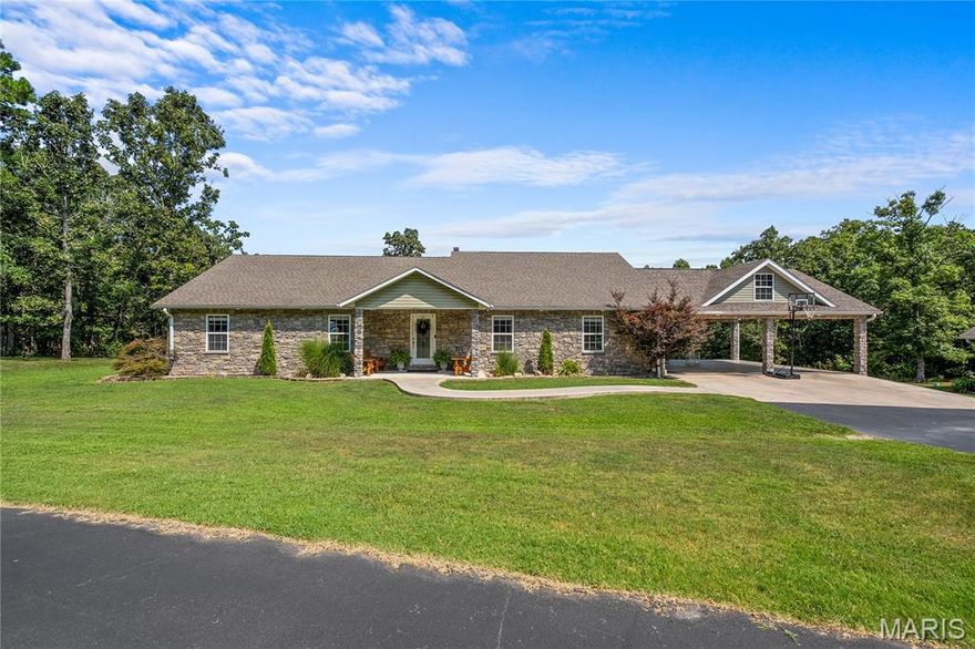 Stunning 6-bedroom, 5-bath estate on 8 +/- private acres with pond & views! Welcome to this breathtaking 4,994 +/- sq ft custom home that perfectly blends luxury and functionality. Featuring 4 spacious bedrooms on main level and an expansive full basement with oversized bedrooms and additional living space, there's room for everyone to relax and recharge! The main level showcases beautiful custom hardwood floors, a cozy fireplace in the living room, and walls of windows that frame serene views of the private acreage. The primary suite is a true retreat with a spa-inspired oversized tile shower. A practical mudroom connects to a large laundry area-ideal for busy families. Outside, enjoy peaceful mornings by the stocked pond, entertain under the carport, or utilize the detached 2-car garage with upstairs storage- perfect for future guest suite or apartment. A dedicated fish cleaning station adds a unique space for outdoor enthusiasts, and the paved driveway ensures easy access year-round. This is one-of-a-kind home that offers, comfort and privacy! You want to see this.