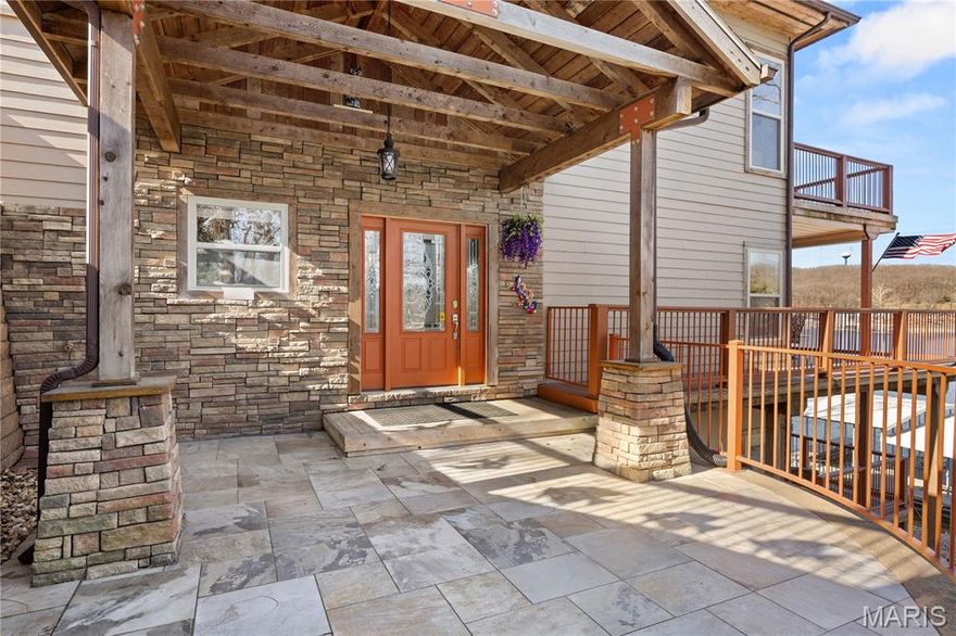 Experience the pinnacle of Colorado Lakefront Style in this exceptional 2,700 sq. ft. retreat. Perfectly situated off Duckhead Rd at MM2 in McCoy Branch Cove, this turnkey 3-bedroom, 3.5-bathroom masterpiece offers 100 feet of gentle lakefront in a sought-after deep-water setting. Watch spectacular sunsets from any of the three expansive covered decks. The fit and finish are unmatched at this price point, featuring rich hardwood floors, granite countertops, stainless appliances, and stained wood trim throughout. Designed for convenience, the home includes laundry on two levels and a newer septic system. The massive living room impresses with vaulted tongue-and-groove ceilings, a stone fireplace, and a home theater sound system. Entertaining is effortless in the lower-level rec room, complete with a wet bar and tiled flooring. Step outside to the 2013 concrete dock, featuring a 12x30 slip, PWC slip, swim platform, and walk-in water access. With ample parking and space to build a two-car garage, this property offers limitless potential. Whether a full-time residence, vacation escape, or investment, this move-in-ready gem is the best value on the water. Check it out today!