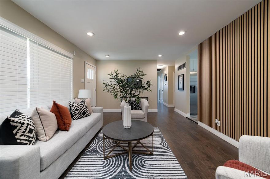 ***Welcome Home to 2405 Orleans!! (Hazelwood West School)****Just move in!***As you enter the living room there is a striking wall and a magnificent view to the right, with french doors, as you step down into your unique bonus sitting/family room, with large bay window, relax in front of your Beautiful Warm & Inviting fireplace, after a long tiring day, with soothing music! There is also space for a breakfast table*** Fabulous kitchen with 42' cabinets, granite countertop, breakfast bar and dual seating, also with a dining area ****All new Whirlpool appliances, ceramic tile flooring & carpeting thru-out. Bright, with lots of windows, new 2 panel doors thru-out. Relax in your hall bath soaking tub.  Custom designs through out. Crown molding & 5" baseboards. Fabulous New lights in place through-out! Ceiling fans w/lights in all bedrooms. Lower Level carpeted Rec Room with 9 can-lights.. This home has so many nice features, to many to list...Must See! Beautiful new front door and striking curb appeal!**** Large Level Corner Lot***RV Parking Pad*** Convenient to stores, public transportation, parks, restaurants, downtown and Lambert Field Airport. "Don't let this one get away!****