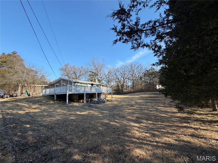 What if the next place you call home gave you space to breathe… inside and out?

Welcome to Valle Lake living in DeSoto, MO — where peaceful surroundings, a nicely sized yard, and everyday comfort come together in all the right ways. This 2 bed, 1 bath home features warm hardwood floors, natural light pouring through oversized windows, and a layout that just feels easy from the moment you walk in. The living room invites you to settle in and stay awhile, while the bedrooms offer quiet retreats at the end of the day. And the kitchen? It has that classic charm and functionality that makes you think, “I can see us here.”

Now here’s where it gets even better.

The walkout basement gives you the flexibility everyone is looking for — storage, hobbies, workout space, a workshop, or even additional living space. You decide. It’s the kind of bonus area that simply makes life more organized and gives you room to grow.

Step outside and you’ll really start to picture it. The large deck overlooks a beautiful, expansive yard — perfect for backyard games, gardening, pets, or just enjoying your morning coffee while taking in the view. Just imagine summer evenings out there.

And something you truly don’t see every day — the garage that doubles as a sunroom. Think bug-free summer dining, birthday parties, holiday gatherings, or game nights with friends. It’s a space designed for connection, without worrying about the weather or the mosquitoes.

If you’ve been waiting for a property with a nicely sized yard, versatility, and that peaceful Valle Lake setting… this might just be the one. Opportunities like this — with a huge yard, walkout basement, large deck, and flexible gathering space — don’t sit around for long.