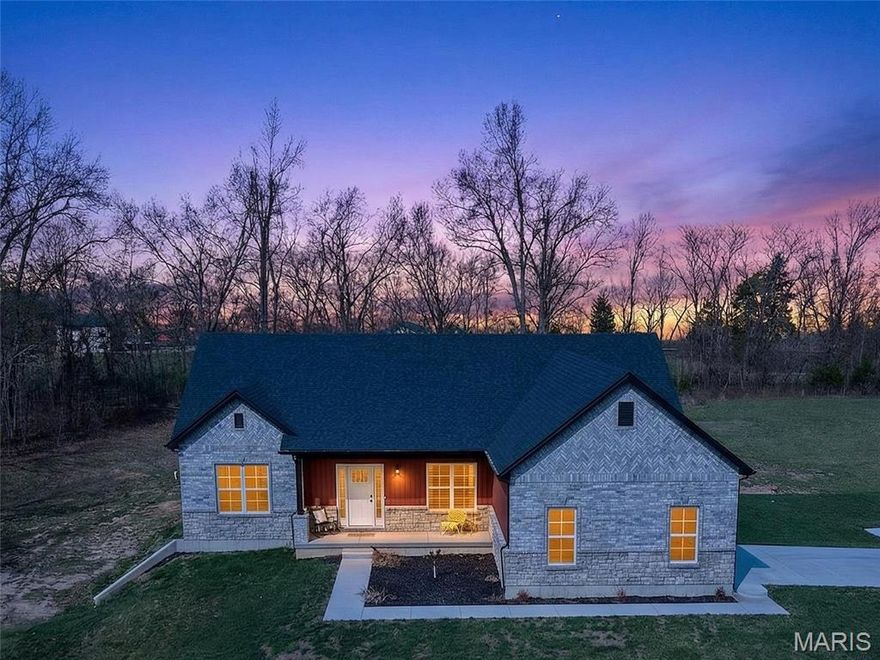 NEW CONSTRUCTION IN WEATHERBY ESTATES, FARMINGTON SCHOOL DISTRICT:
Located just minutes from Farmington, this 2,495 sq. ft. custom-built home is packed with features. Not only is there an open floor plan, but you're sure to love the large rooms, elegant vaulted and coffered ceilings, cozy gas fireplace, formal dining room perfect for gatherings, beautiful kitchen with stainless steel range, refrigerator over range microwave and dishwasher, split bedrooms for added privacy and a large master suite with a soaking tub, separate shower and a big walk-in closet. The full walk-out basement is a blank canvas for whatever your imagination desires. There's a family room, game room, exercise/workout room, trophy room or that home theater you've always wanted already finished out, and plenty of unfinished area too. There's a 2-car attached garage that's finished out, drywalled, textured and painted. Outside offers a large covered front porch and some beautiful craftmanship with eye-catching brick and stone masonry. This peaceful setting sits on 3 level acres adjacent to Twins Oak Winery. This home offers the space, style, and setting you've been looking for-without sacrificing convenience!