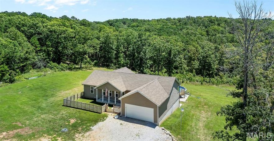 Don’t miss your chance to tour this custom built 4 bedroom, 3 bath home set on 14.29 beautiful acres. Designed with an open concept layout, this home features a spacious kitchen and living area, a 2 car attached garage, and a fully finished basement complete with a wet bar, pool table, and home gym, perfect for entertaining or relaxing.

Step outside and enjoy the above-ground pool, ideal for summer days. Additional upgrades include a dual-zoned HVAC system and a constant water pressure system for added comfort and efficiency.

As a bonus, the property also includes a charming log cabin offering 1,100 square feet of living space, including 1 bedroom and a full bath, ideal for guests, in-laws, or potential rental income.

Schedule your private showing today to experience all this unique property has to offer!