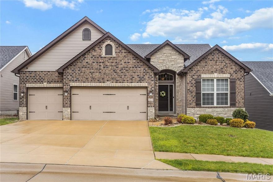 Welcome Home! This 4 bedroom, 3 bath single-family residence, built in 2017 is a very unique home that presents an opportunity for contemporary living. You will enter into an open concept atrium ranch with soaring vaulted ceilings, breathtaking newer 3/4" solid white oak flooring, and atrium windows across the back of the home.  Step into the newly remodeled kitchen and you will notice beautiful custom stained solid wood cabinets and gorgeous quartz countertops, stainless steel appliances, double oven with glass top stove, and newer Bosch dishwasher with 3rd rack. You can't miss the huge kitchen island with solid brass enormous pendant lighting above and seating for at least 7 and also has extra storage on 3 sides.  Double cabinet pantries!  Kitchen storage galore!! The large living room boasts custom built-in shelves, a vented gas fireplace with floor to ceiling stone tile with a dark wood mantle. Main floor laundry! 3 bedrooms, 2 baths are on the main floor. Large bedroom in basement with a walk-in closet and a full bath nearby. You will enjoy a spacious family room perfect for game-nights, equipped with more custom built-in shelves. There is a wet bar with very unique quartzite countertops to entertain your guests.  The back yard has been professionally landscaped with stone boulder steps down to the expansive patio. This home is located on a street that has homes only on 1 side of the street, so you look out of the front of your home to common ground that is wooded. This one won't last long!! Home is agent-owned.
