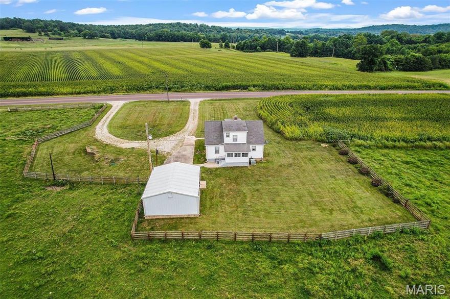 ONLY 5O+/- AC SOLD ON SOUTH SIDE. A picturesque 105+/- Acre farm property is situated conveniently off Hwy 100. The highway splits the property. This property features a 1.5-story home with a large living room, a cozy kitchen, a separate dining room, and a main-floor bedroom. The upper level offers two carpeted bedrooms and a bonus room. Ample closet space. The walk-up lower level features a family room set-up, office, and enhances plenty of storage space for those extra belongings. A nice 11x9 screened-in sunroom can serve as a space for entertaining guests or simply relaxing while enjoying the outdoors. 21x27 2-car oversized detached garage with electricity and concrete. The property boasts ponds, a creek, fencing, and a mixture of crops, pasture, and woods. This property offers a variety of residential comfort, farming, outdoor amenities, and recreation, making it an attractive option for those seeking a country lifestyle. The property includes 2 tax ID#. SOLD Only 50+/-ac on south side of the property.