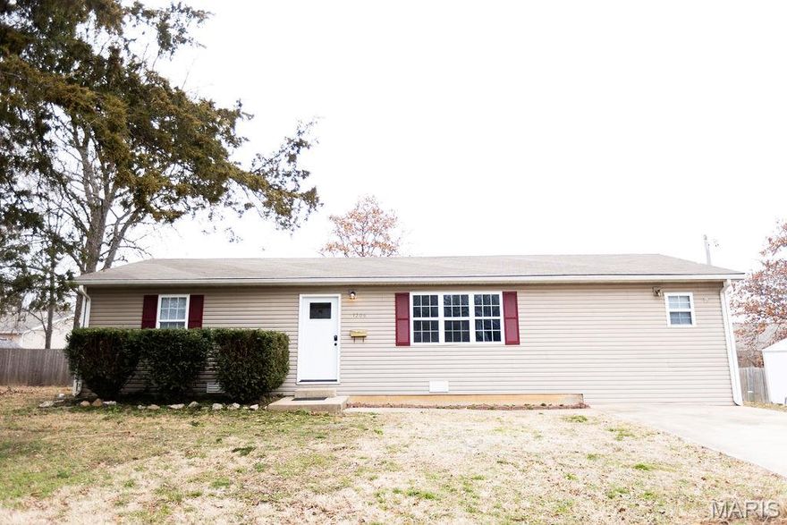 Located in the heart of Rolla and within walking distance to local schools, this beautifully updated 3-bedroom, 2-bathroom home offers style, comfort, and convenience all in one package! Luxury vinyl plank flooring flows seamlessly throughout, creating a modern and cohesive feel. The spacious living room welcomes you in and opens to a bright eat-in kitchen featuring crisp white cabinetry, classic subway tile backsplash, and direct access to the deck—perfect for enjoying your morning coffee while overlooking the backyard.  The laundry area is thoughtfully tucked away behind a stylish sliding barn door, adding both charm and functionality. The primary bedroom features a private ensuite bathroom with a shower, while two additional bedrooms and a full guest bath complete the layout. Move-in ready and centrally located, this home is the perfect blend of updated finishes and everyday practicality!