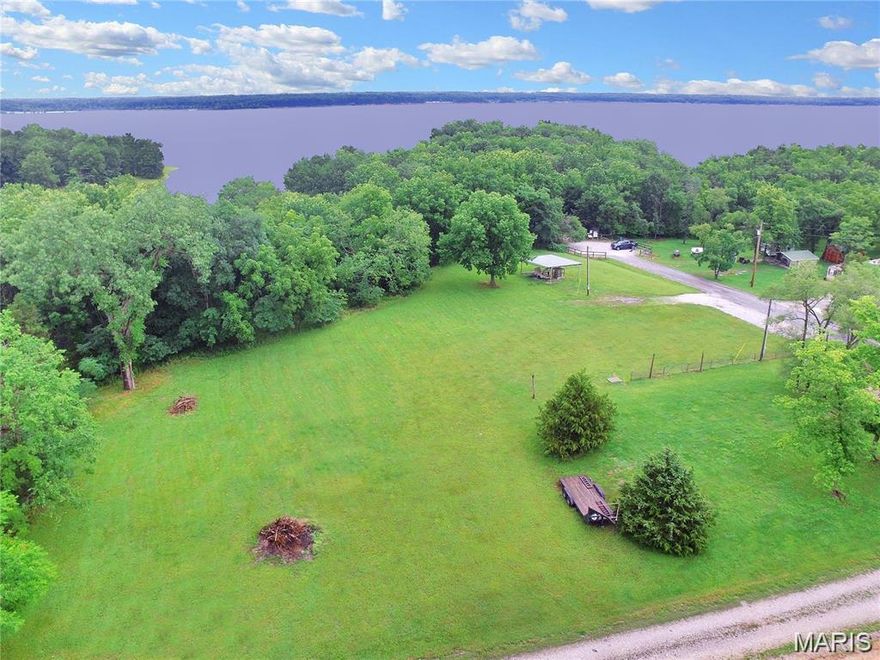 WOW! Very rare opportunity to own a unique piece of land in historic Florida, Missouri at Mark Twain Lake! Location, Location, Location! This 2.0 +/- acre property sits near the tip of the peninsula at the center of the Lake, right on the blue line (as close to the lake as you can own). Could be divided into 8 lots + for mobile or stand alone units. So much history in this beautiful community at the birthplace of Mark Twain. Follow the trail next to the property and take the short walk right down to the lake. Lots to do here including boating, swimming, fishing and more! This level property could be your private dream home/barndominium/cabin and could also be an opportunity to build storage or recreational units. With all of the activity & history surrounding this area, perhaps a commercial use is your dream. Boat dock is located just 1 mile close to entrance to Florida. Close also to Mark Twain State Park. Water and electric already on the property. It's a jewel and you don't want to miss this great opportunity to be on the Lake!